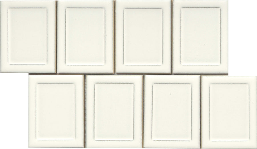 Eight Marco and Polo 4x5 Glossy Porcelain Tiles in Marco White, arranged in two uneven rows; each tile has a recessed rectangular border for a framed, designer-inspired look.