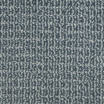 Close-up of Yucatan Pet Friendly Carpet in Marine—stain resistant with a textured gray-blue look, subtle irregular grid pattern, and slightly rough, looped surface.