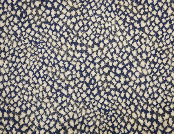 Close-up of Serengeti On Trend Carpet in Marine—a blue surface with an irregular cream and beige spotted pattern, ideal for contemporary interiors seeking stylish, quality flooring with lasting performance.