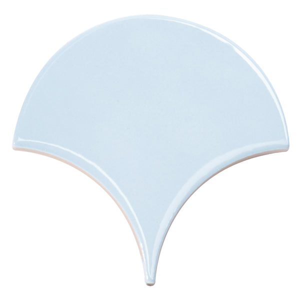 The Tidal 2x5 Ceramic Tile features a glossy light blue finish and a unique fan-shaped scallop design with smooth curves and a pointed bottom—an elegant choice for adding luxury to any space.