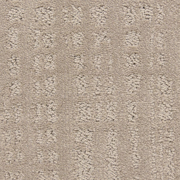 Close-up of the Willow Lake On Trend Carpet in Media Room, showing a textured geometric pattern with raised rectangles and dots. Its soft fibers offer luxury, while the durable design suits high-traffic areas.