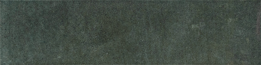 A rectangular swatch of Menagerie 2.5x9.5 Porcelain Tile in dark green, featuring a soft, slightly textured surface and subtle shading variations for a handmade look.