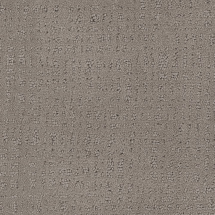 A close-up of Homage Berber Carpet in Meritage shows textured gray fabric with a subtle grid and small raised dots—luxuriously designed for high-traffic areas.