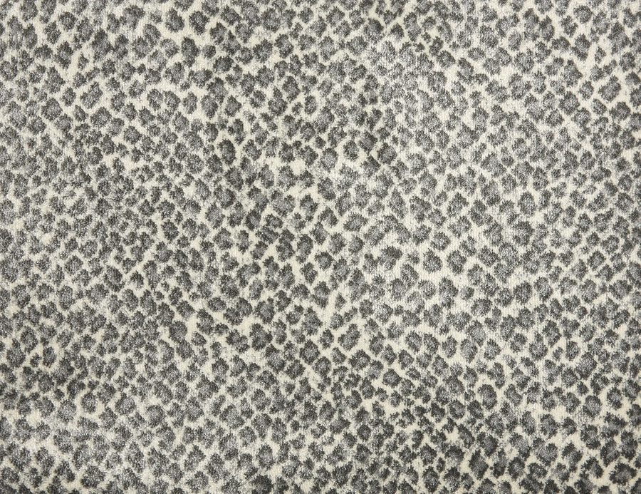 Close-up of Serengeti On Trend Carpet in Metal, featuring a gray and white animal print reminiscent of leopard spots—an ideal choice for adding contemporary flair to modern flooring or interiors.
