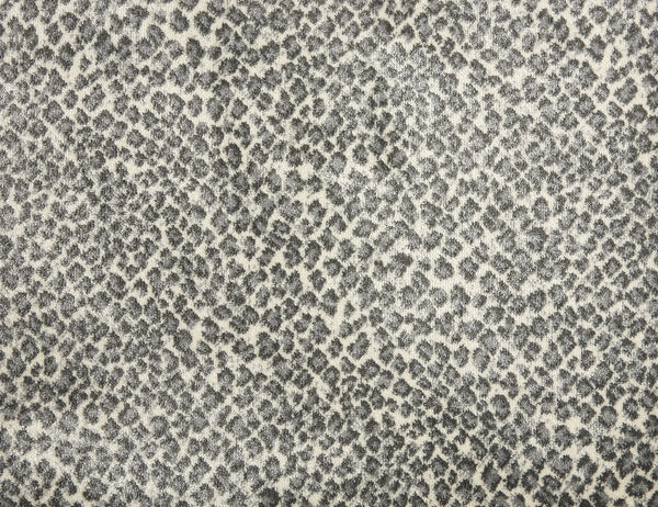 Close-up of Serengeti On Trend Carpet in Metal, featuring a gray and white animal print reminiscent of leopard spots—an ideal choice for adding contemporary flair to modern flooring or interiors.