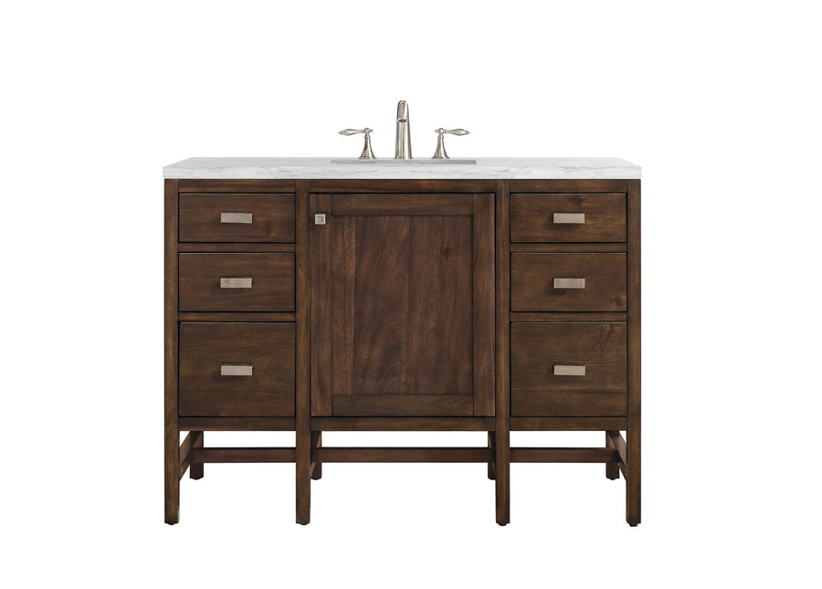 The Addison 48" Vanity is a modular bathroom vanity with a white marble top, sleek silver handles, six drawers, and a central cabinet door featuring reversible panels.