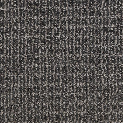 Close-up of Yucatan Pet Friendly Carpet in Midnight color, featuring a durable, textured surface with a subtle grid-like pattern from raised and recessed fibers.