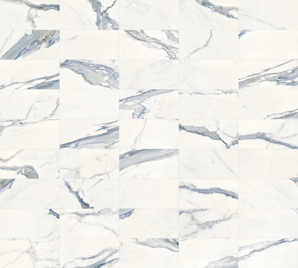 White marble tiles with gray and blue veining arranged in a grid pattern, creating a seamless, elegant, and modern surface suitable for floors or walls.