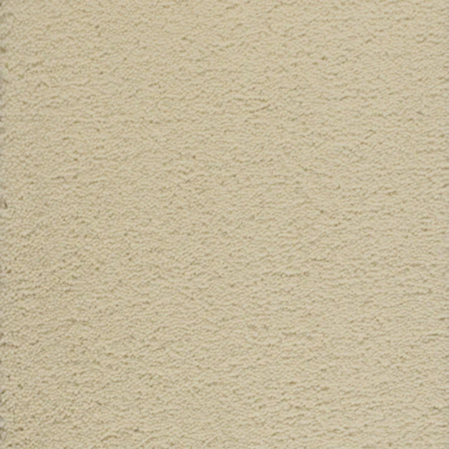 A close-up view of Dolce Family Friendly Carpet in Milkshake—ideal for high-traffic areas, featuring a beige textured surface with small ridges and indentations for added durability.