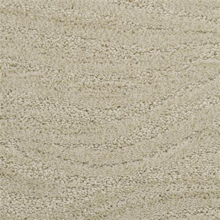 Close-up of Taittinger On Trend Carpet in Mirage—beige with a looped pile and subtle wavy patterns, offering soft, cozy luxury flooring ideal for high-traffic areas.