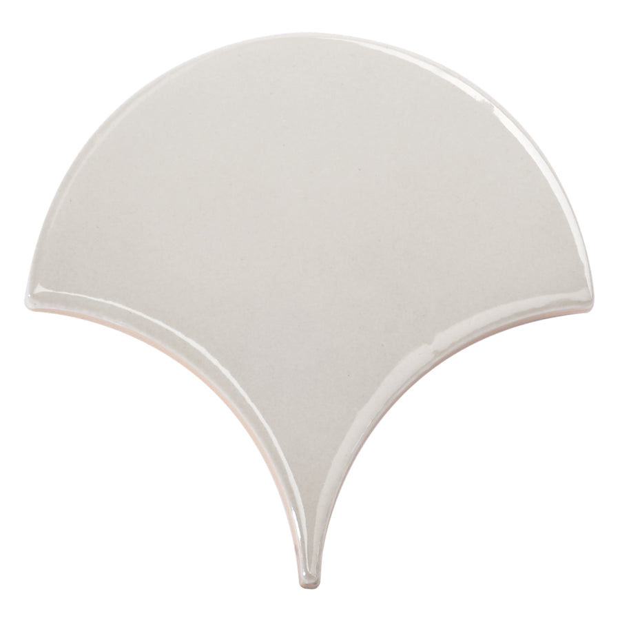 The Tidal 2x5 Ceramic Tile features a glossy light gray finish and a distinctive fan-shaped design, bringing elegant luxury to any space.