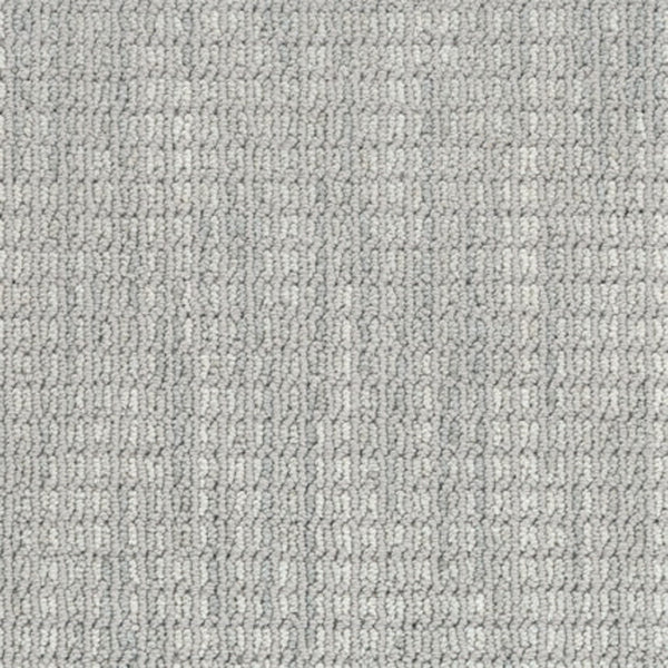Close-up of Haven Berber Carpet in Mist, a light gray, durable carpet featuring a subtle, repeating textured pattern of small rectangular loops for a soft yet structured look.