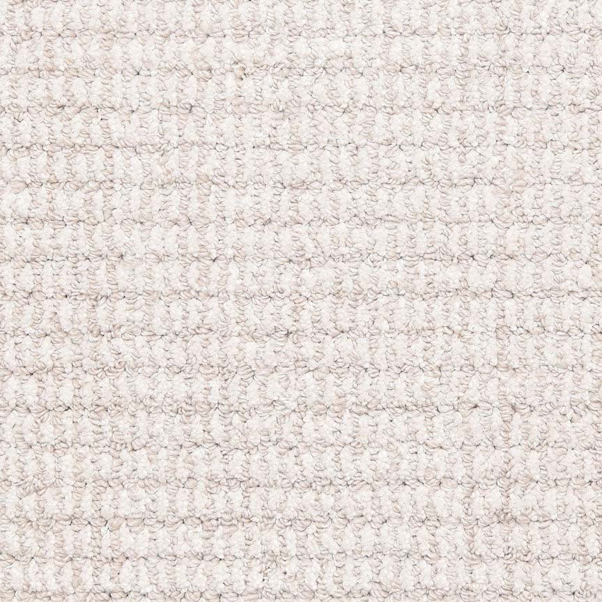 Close-up of Aspen Berber Carpet in Mist, featuring a looped pile with a grid-like pattern. The surface is soft and uniform, highlighting its textured, woven fibers and regular repeating design.