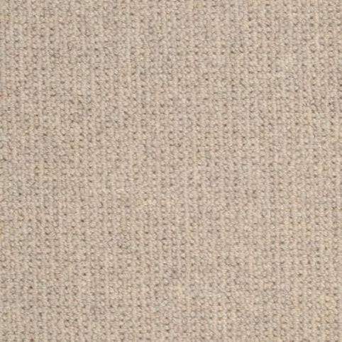 Close-up of Dublin Berber Carpet in Monahan color, highlighting its soft beige knit, uniform textured pattern, and small, evenly spaced stitches reminiscent of premium Berber flooring.