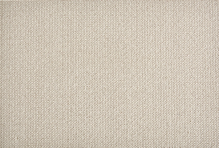 Close-up view of Harper Berber Carpet in Moonshine color, featuring a tightly woven, uniform texture. This durable and comfortable surface is ideal for everyday use in home or office settings.