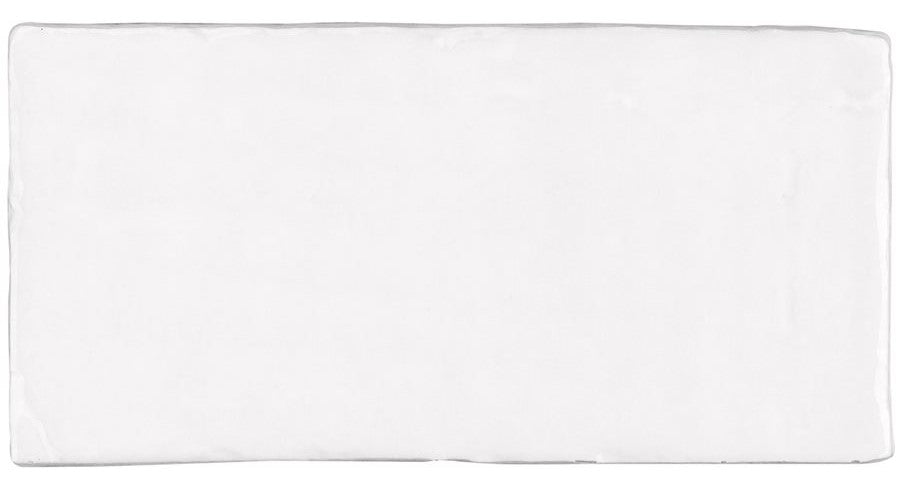 The Morocco 4x8 White Body Ceramic Tile features a smooth, glossy finish and subtly irregular edges, bringing rustic allure and timeless charm to any space.