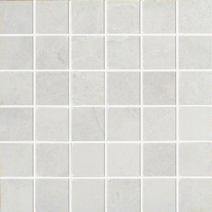 A grid of Gemini 2x2 Mosaic Tile in light gray porcelain stoneware with thin white grout lines creates a clean, simple geometric pattern.