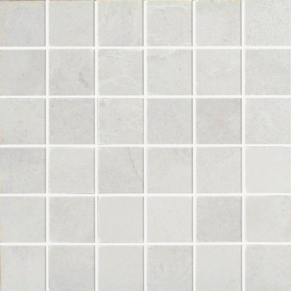 A grid of Gemini 2x2 Mosaic Tile in light gray porcelain stoneware with thin white grout lines creates a clean, simple geometric pattern.