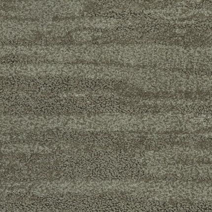 Close-up of Cirrus Berber Carpet in Moss—a textured surface with a mottled gray and olive green pattern, subtle wavy lines, and a grainy, stone-like appearance for a premium flooring look.