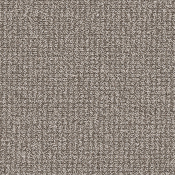 Close-up of a textured Mykonos Berber Carpet in Athens color, showing a soft berber weave with a small, repeating square pattern that adds subtle shading and luxurious style to any room.