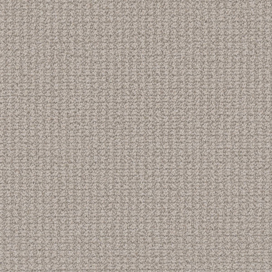 A close-up of the Mykonos Berber Carpet in Bay Dream highlights its tightly looped berber weave, creating a subtle grid pattern and bringing a luxurious look to any room.