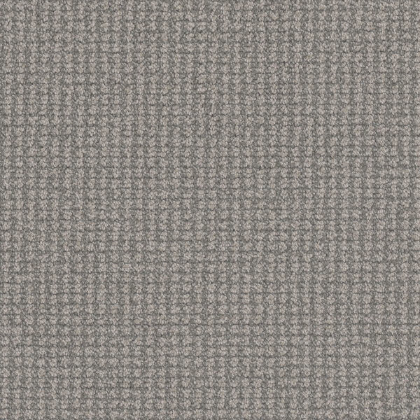 Close-up of the Mykonos Berber Carpet in Naples, featuring a textured grey fabric with a small, repeating square pattern—an elegant choice for luxury flooring.