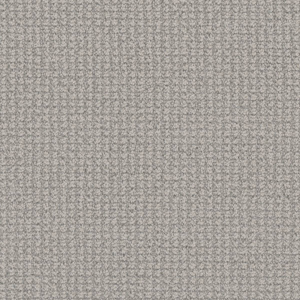 Close-up of Mykonos Berber Carpet in Nautilus, featuring a light gray, textured surface with a subtle woven grid pattern and soft, raised feel similar to luxury berber weave.