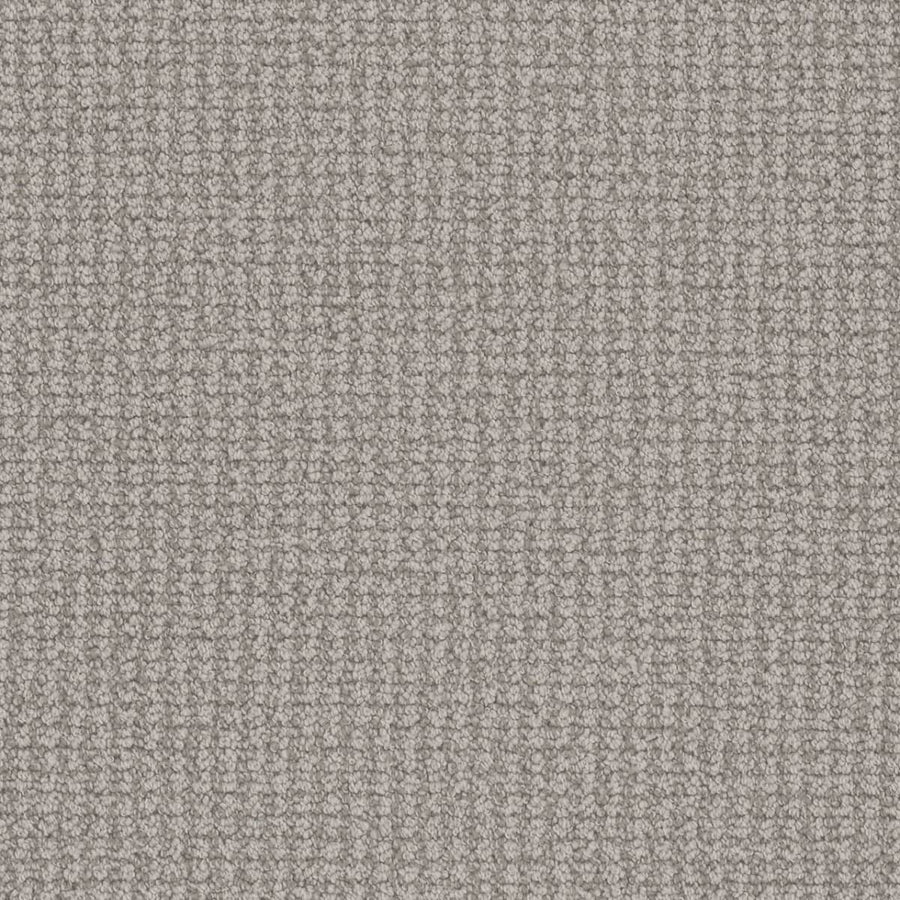 Close-up of the Mykonos Berber Carpet in Riviera, highlighting its soft, textured surface and grid-like berber weave. Tightly packed loops offer even lighting and showcase the luxurious quality of this premium flooring.