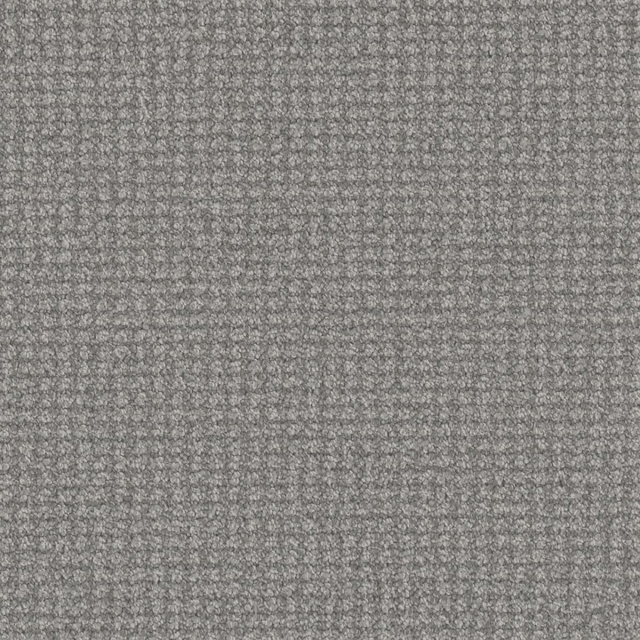 Close-up of the Mykonos Berber Carpet in Royalty color, featuring a tight berber weave with small threads that form a subtle, grid-like texture for a soft and slightly raised surface.
