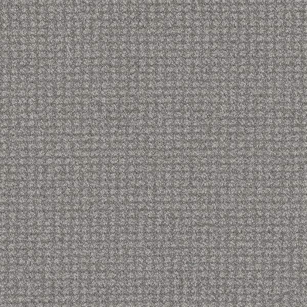 Close-up of the Mykonos Berber Carpet in Royalty color, featuring a tight berber weave with small threads that form a subtle, grid-like texture for a soft and slightly raised surface.