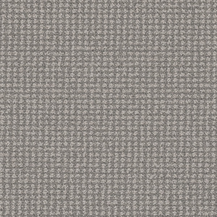 Close-up of Mykonos Berber Carpet in Santa Marina, featuring a textured gray fabric with a small, repeating checkered pattern that evokes luxury flooring through its refined blend of light and dark threads.