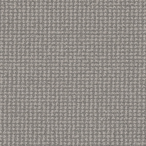 Close-up of Mykonos Berber Carpet in Santa Marina, featuring a textured gray fabric with a small, repeating checkered pattern that evokes luxury flooring through its refined blend of light and dark threads.