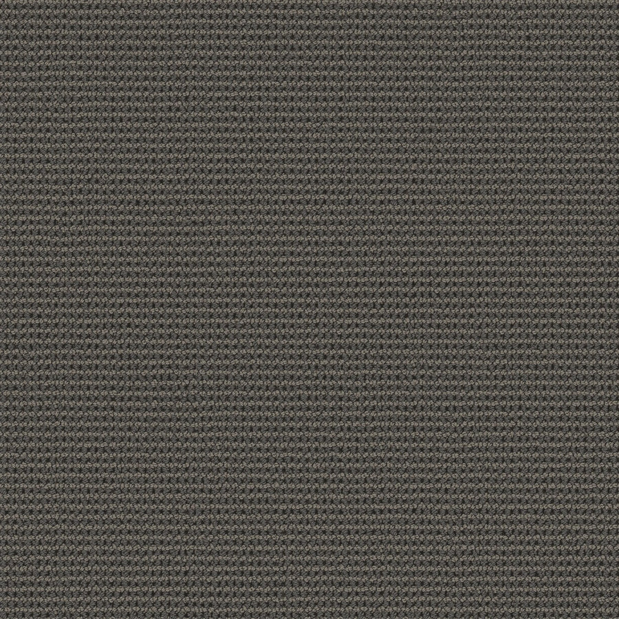A close-up of the Knitted Tone Pet Friendly Carpet in Mysterious shows its dark gray, tightly woven, subtly ribbed texture—crafted for durability and perfect for high-traffic areas needing a uniform surface.