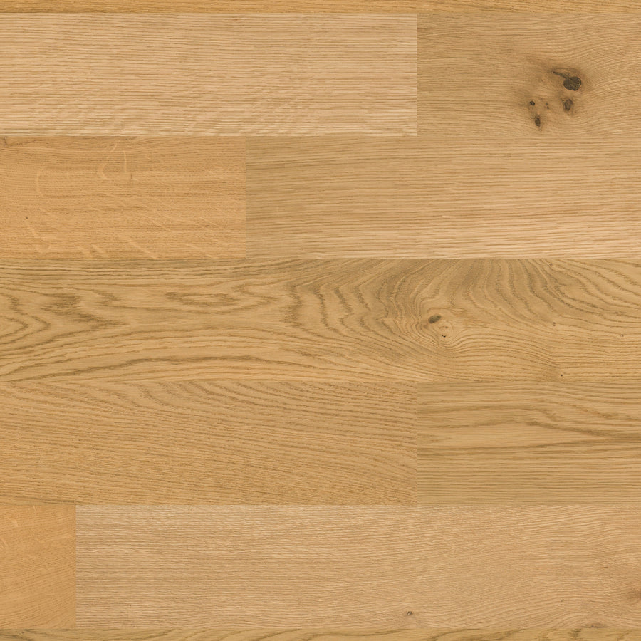 The Huntington European Oak 7 1/2" Hardwood features a light natural finish with visible grain and knots in a staggered plank design. Its smooth, even surface beautifully highlights the unique character of premium European Oak.