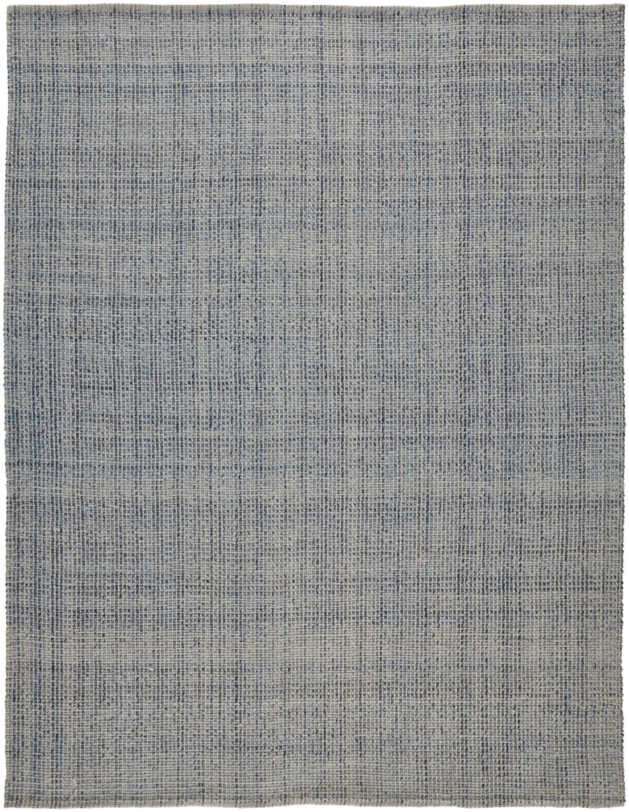 The Naples Area Rug is a rectangular, flat-woven piece with intersecting blue and gray lines forming a soft grid on a neutral background. Its straight, clean edges add to the rug’s refined and elegant look.