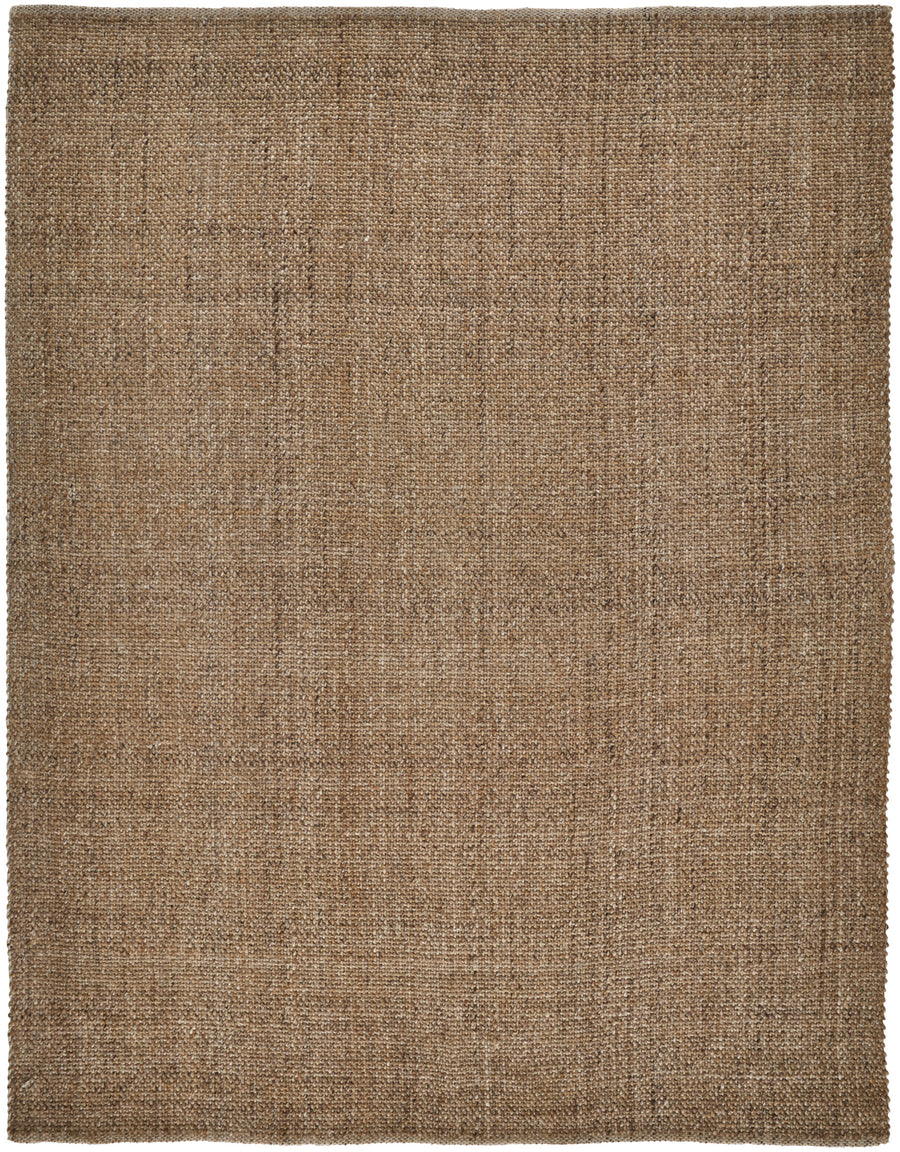 The Naples Area Rug is a square, flat-woven rug made from natural fibers in light brown tan with a subtle texture and visible weave, adding an elegant touch to any room.