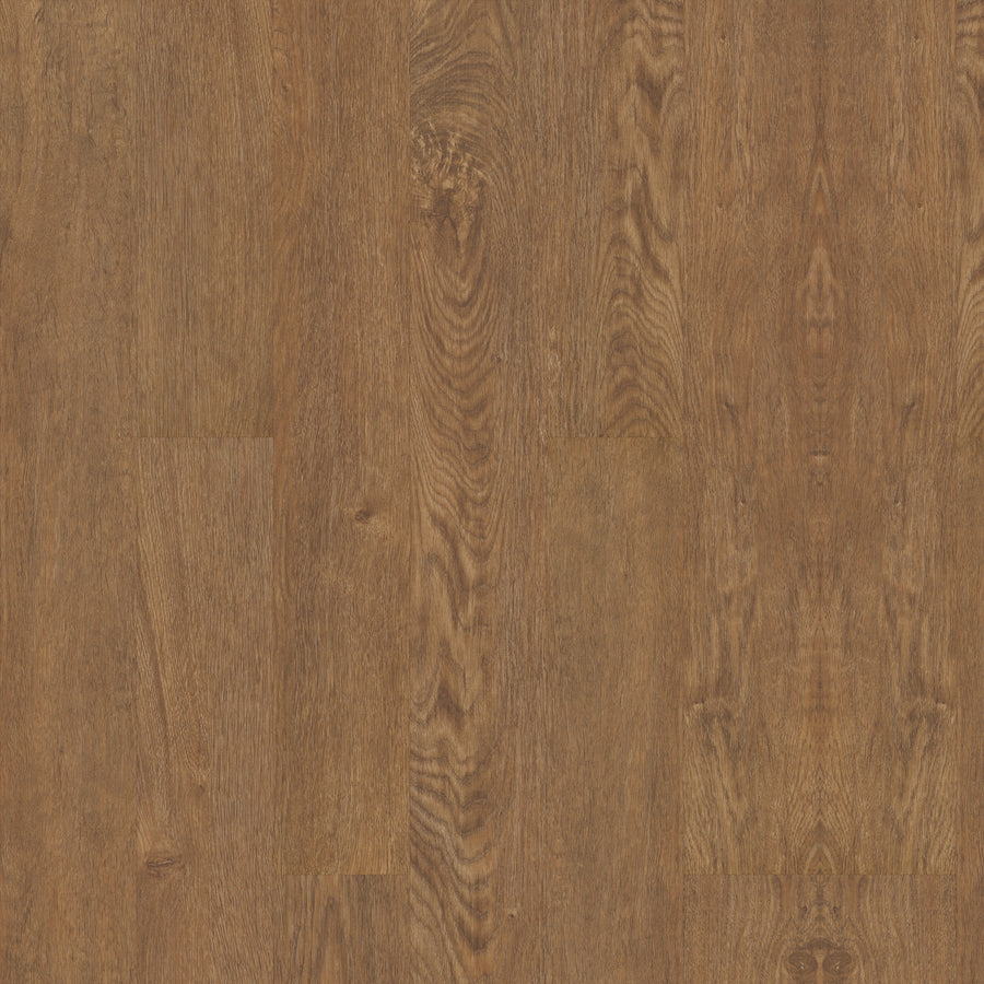 A close-up of Coretec Originals Classics Vinyl flooring shows a warm brown finish with natural wood grain patterns and subtle color variations, combining authentic wood visuals with the durability of rigid core construction.
