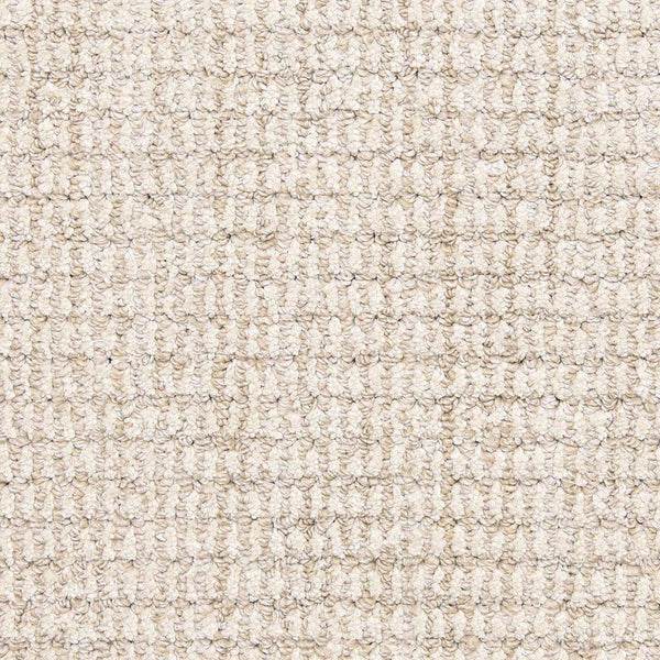 Close-up of Aspen Berber Carpet in Natural color, featuring a looped pile and grid-like textured design. The tightly woven yarns create a soft, durable carpet with a uniform appearance.