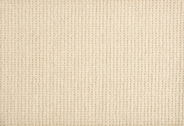 Close-up of Martina Berber Carpet in Natural, showing a beige, textured woven grid pattern. The soft, uniform surface has subtle thread variations—ideal for contemporary spaces or high-traffic areas needing lasting style.