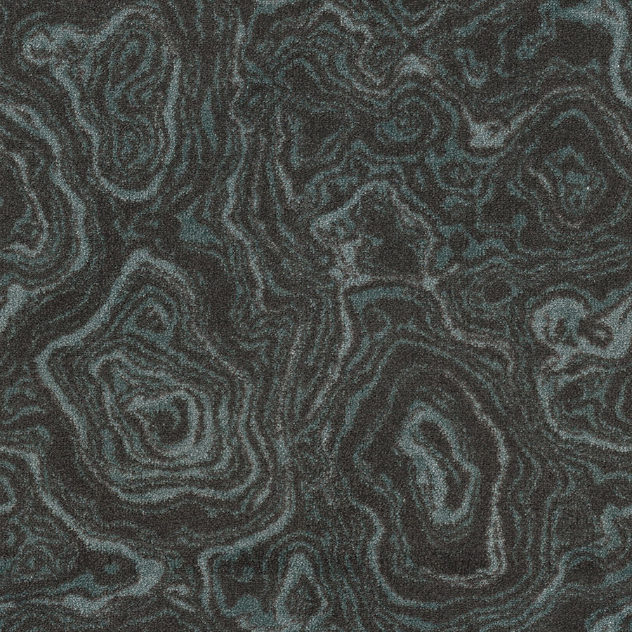 Nature's Gem On Trend Carpet features a dark gray and black surface with swirling, layered patterns like natural stone, accented by subtle teal highlights—an eye-catching, stylish carpet that brings vibrant color to any room.