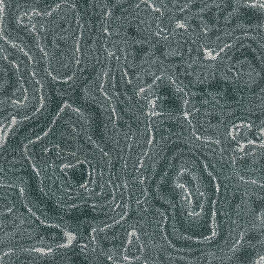 Close-up of a textured surface with swirling, layered mineral patterns in dark green, gray, and white—an abstract organic design featured in Nature's Gem On Trend Carpet, ideal for durable and stylish flooring.