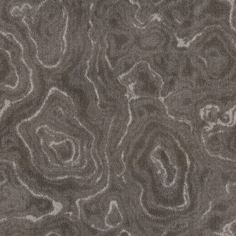 Close-up of Nature's Gem On Trend Carpet, featuring a textured, durable surface with swirling patterns like topographic lines or wood grain in earthy browns and grays for an organic, modern look.