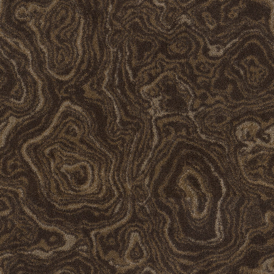 A close-up view of the brown and tan marbled texture with swirling, layered patterns in Nature's Gem On Trend Carpet—perfect inspiration for vibrant, durable carpet designs.
