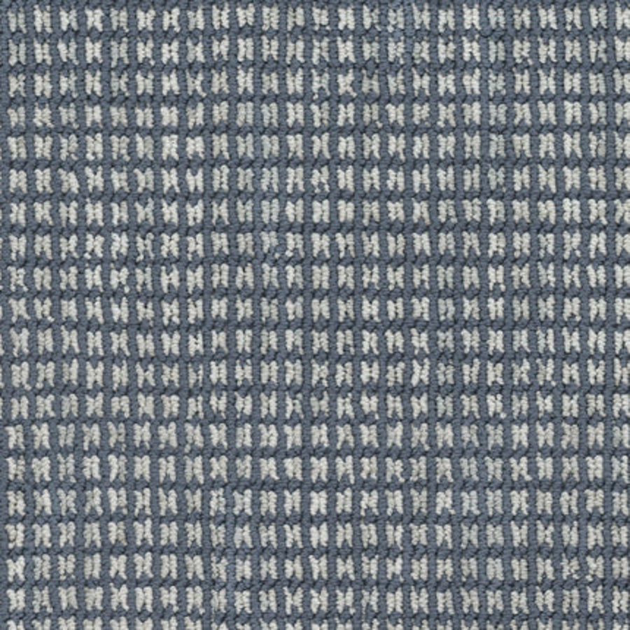 Close-up of Haven Berber Carpet in Nautical, showcasing a textured fabric with a small, repeating blue and white checkered pattern, echoing the durable and intricate grid-like design characteristic of Berber carpets.