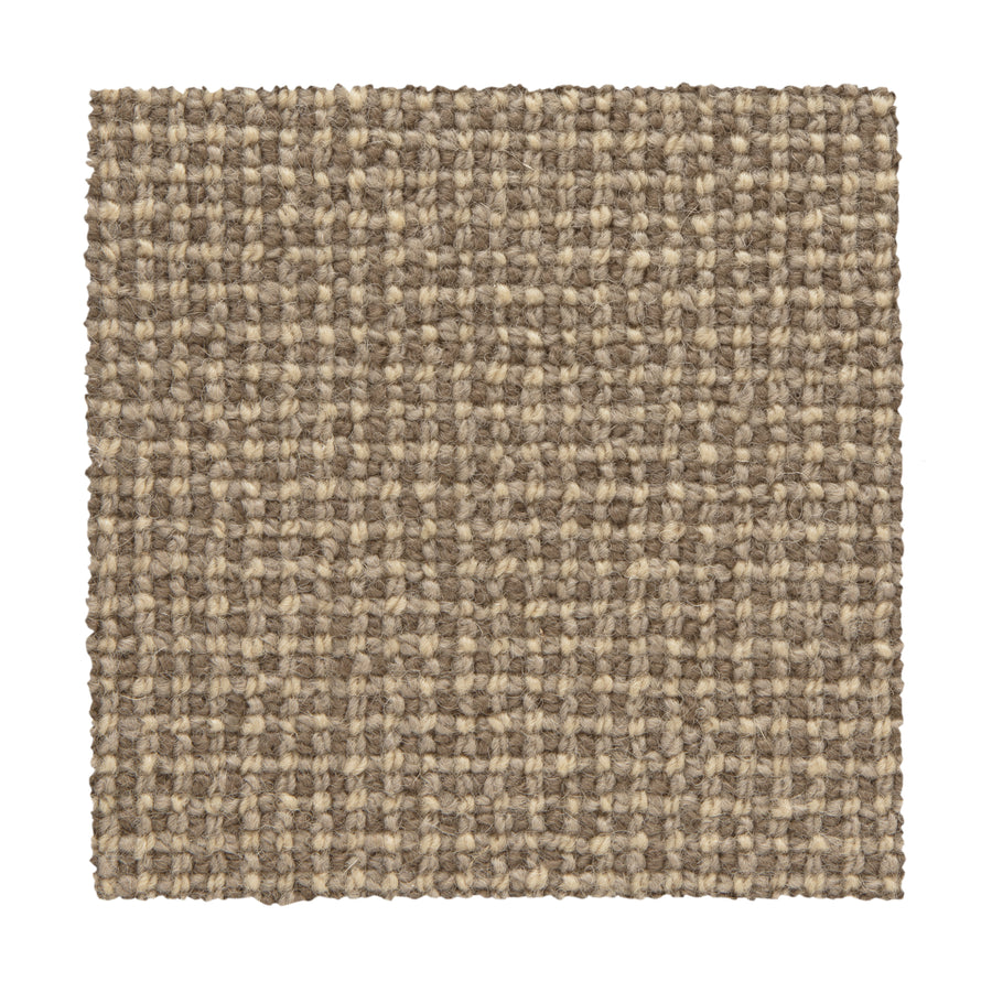A square swatch of Needlepoint III Berber Carpet in Coffee shows a textured, grid-like woven pattern in beige and brown tones on a white background—ideal for high-traffic areas.