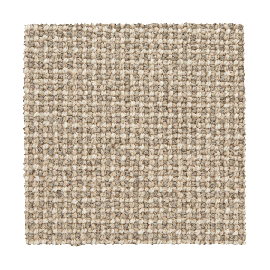 The Needlepoint III Berber Carpet in Happy features a square swatch of textured, beige, grid-patterned loops. Its light tan and cream mix creates a natural look that's luxurious and ideal for high-traffic areas.