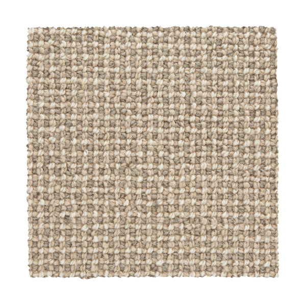 The Needlepoint III Berber Carpet in Happy features a square swatch of textured, beige, grid-patterned loops. Its light tan and cream mix creates a natural look that's luxurious and ideal for high-traffic areas.