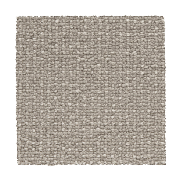 A square sample of Needlepoint III Berber Carpet in Mortar is shown on a white background, highlighting its light gray color and uniform, tightly woven texture ideal for high-traffic areas.