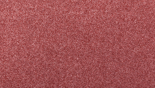 A close-up of the Noble Surface Pet Friendly Carpet in Desert Rose, showcasing its festive, glittery texture—an ideal stain-resistant option for busy homes with pets.