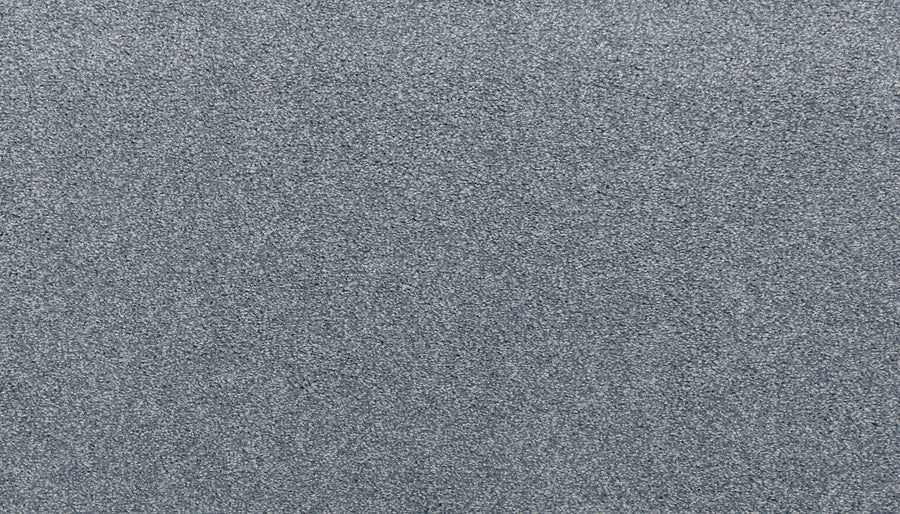A close-up view of the Noble Surface Pet Friendly Carpet in Hydrangea color, showcasing its durable, textured gray surface with a uniform, grainy appearance.